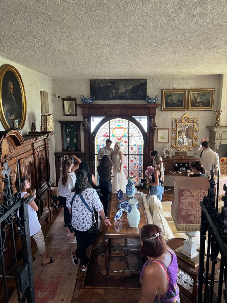 Participants that photographs a couple in front of a beautiful mosaic in one of the rooms