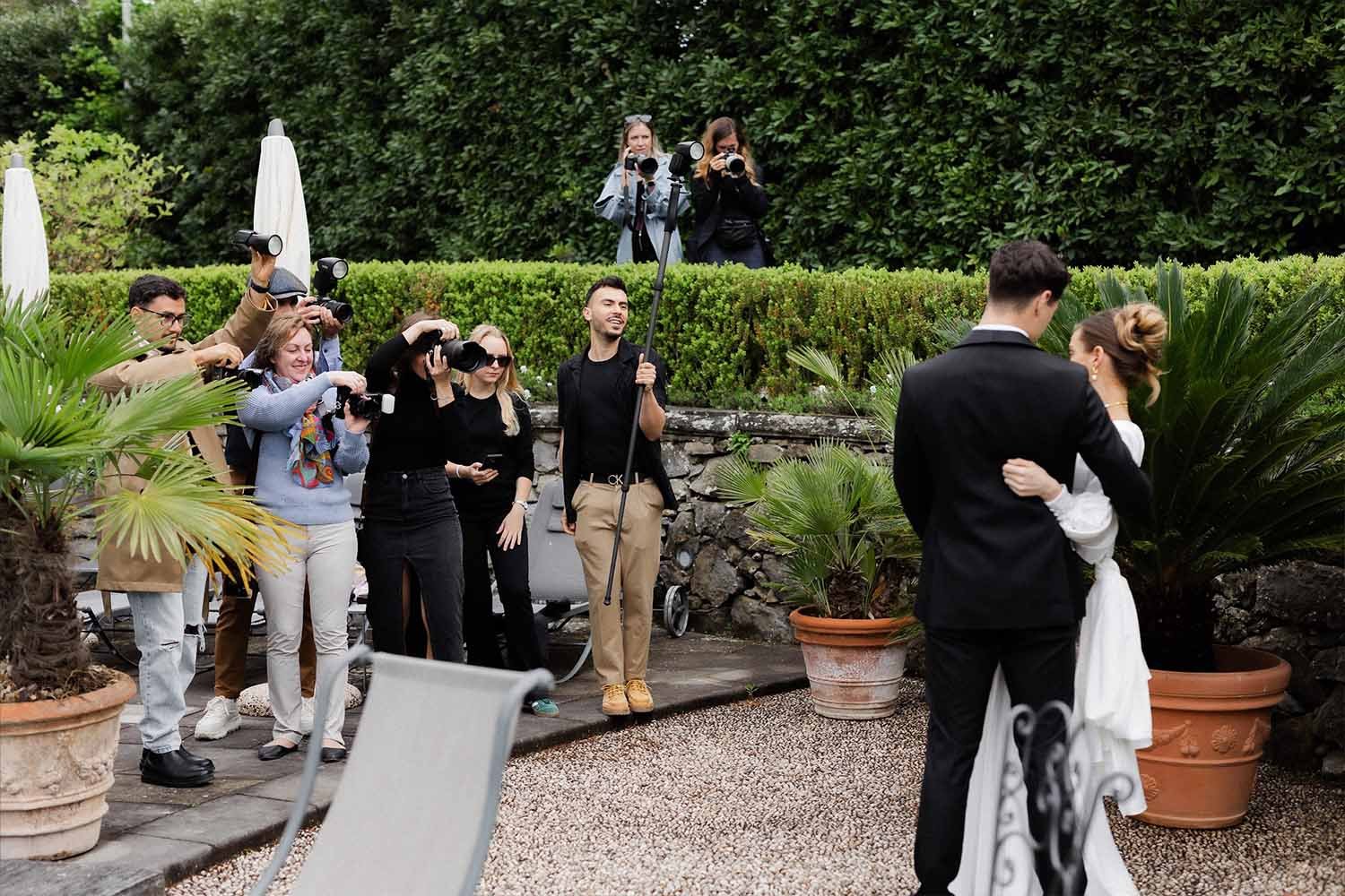 Couple poses for photographers in the garden