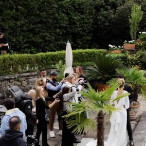 A couple poses for photographers in the garden